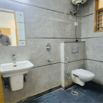 Bathroom in 1 BHK Builder Floor at Palm Residency Chhatarpur, Rajpur Khurd Extension – for Rent