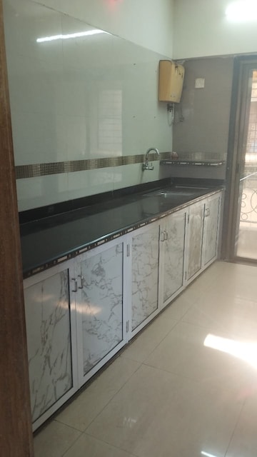 Kitchen in 2 BHK Apartment at Regency Estate, Dombivli East – for Rent