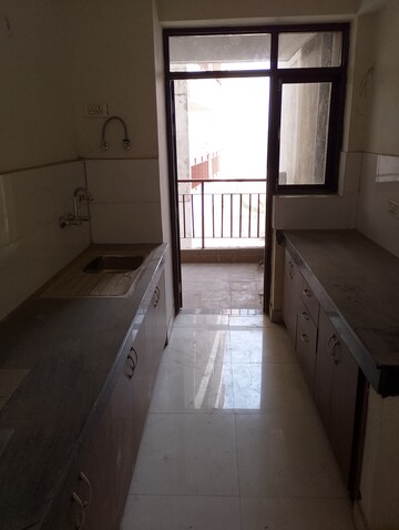 Kitchen in 2 BHK Apartment at Cosmos Express 99, Sector 99 – for Sale