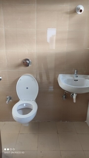 Bathroom in 1 BHK Apartment at Raunak Bliss, Ghodbunder Road – for Rent