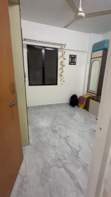 Bedroom in 1 BHK Apartment at Kundan Palace, Ulhasnagar – for Sale