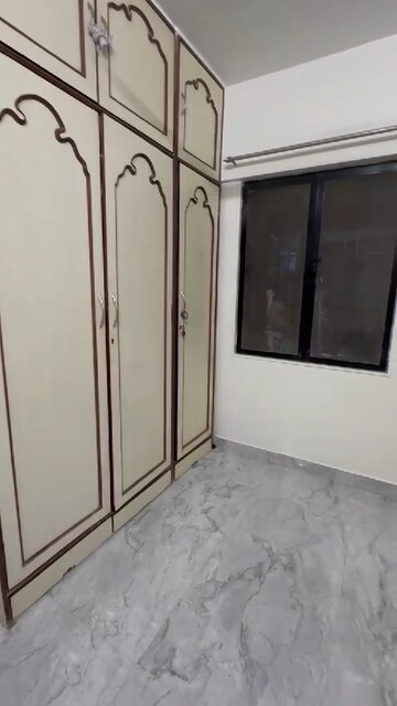 Bedroom in 1 BHK Apartment at Kundan Palace, Ulhasnagar – for Sale