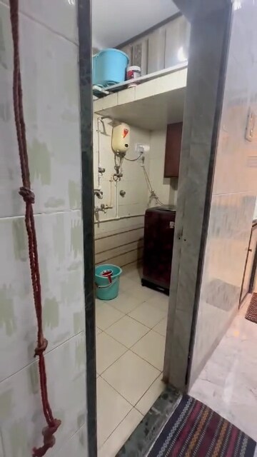 Bathroom in 1 BHK Apartment at Kundan Palace, Ulhasnagar – for Sale