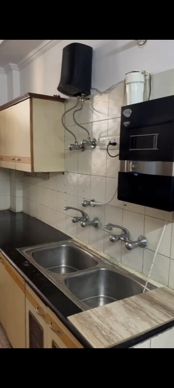 Kitchen in 4 BHK Apartment at Panchsheel Sps Residency, Ahinsa Khand ii – for Rent