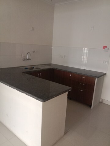 Kitchen in 1 BHK Apartment at Cosmos Express 99, Sector 99 – for Sale