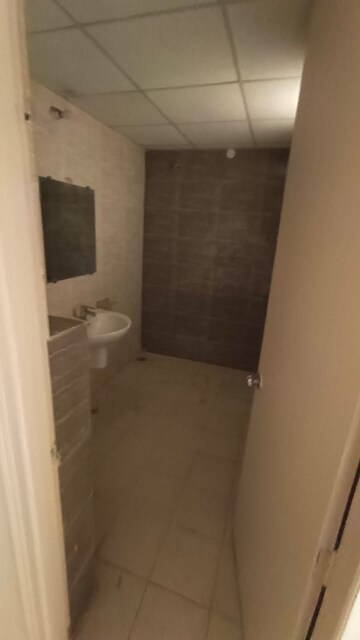 Bathroom in 2 BHK Apartment at Adore Happy Homes Pride, Sector 75 – for Sale