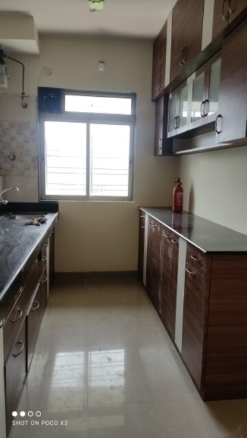Kitchen in 1 BHK Apartment at Rosa Gardenia, Ghodbunder Road – for Rent
