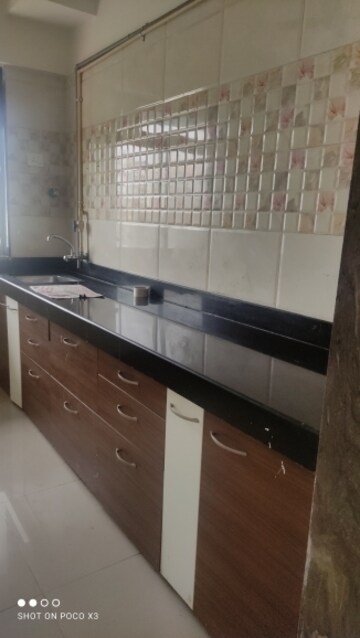 Kitchen in 1 BHK Apartment at Rosa Gardenia, Ghodbunder Road – for Rent