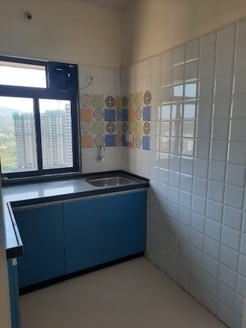 Kitchen in 1 BHK Apartment at Raunak Heights, Ghodbunder Road – for Rent