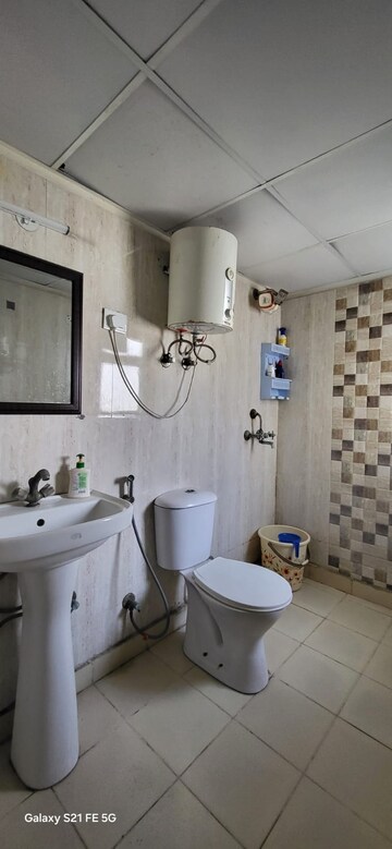 Bathroom in 2 BHK Apartment at Aditya Celebrity Homes, Sector 76 – for Sale