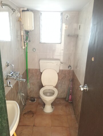 Bathroom in 1 BHK Apartment at Bindra Complex, Andheri East – for Sale