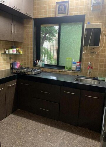Kitchen in 2 BHK Apartment at Takshila CHS, Andheri East – for Rent