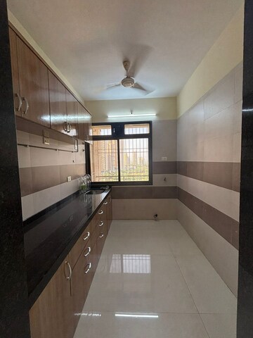 Kitchen in 2 BHK Apartment at Gami Reagan, Ghansoli – for Sale