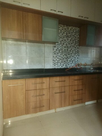 Kitchen in 2 BHK Apartment at Poddar Palm Meadows, Makarba – for Rent