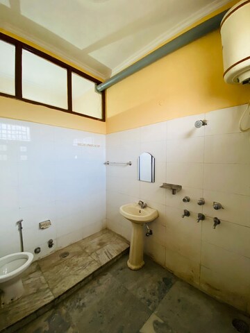 Bathroom in 2 BHK Apartment at Sunny Enclave – for Rent