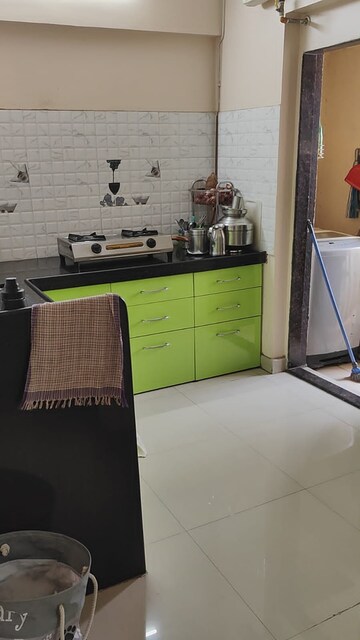 Kitchen in 1 BHK Apartment at Unnathi Woods Phase 1 And 2, Ghodbunder Road – for Rent