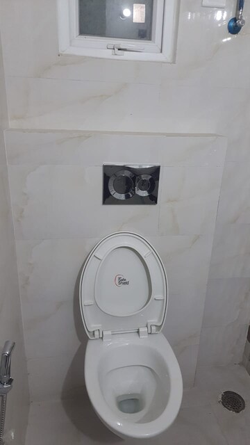 Bathroom in 4 BHK Apartment at Paradigm Business Hermitage Park, Dhakoli Village – for Rent
