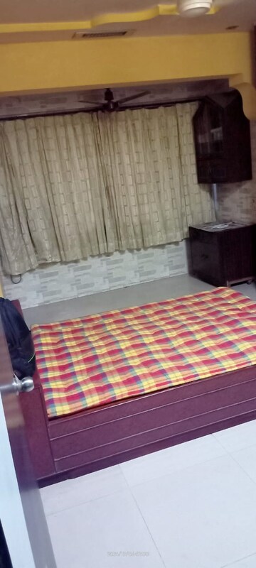 Bedroom in 1 BHK Apartment at Sai Om CHS, Louis Wadi – for Rent