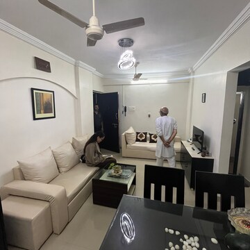 Living Room in 1 BHK Apartment at Exotic Palace, Yari Road – for Rent