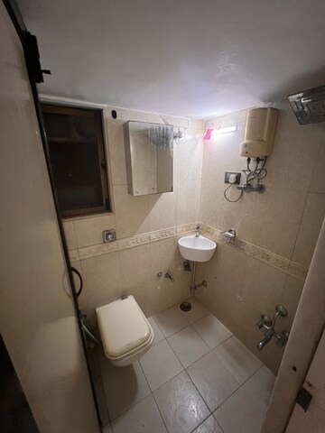 Bathroom in 1 BHK Apartment at Ajmera Odyessey Apartment, Wadala – for Rent