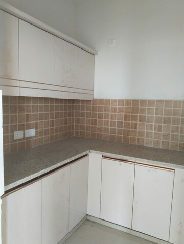 Kitchen in 2 BHK Apartment at Mahagun Mywoods, Sector 16c Greater Noida – for Rent