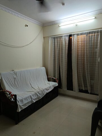 Living Room in 1 BHK Apartment at Nikita CHS, Ghansoli – for Sale