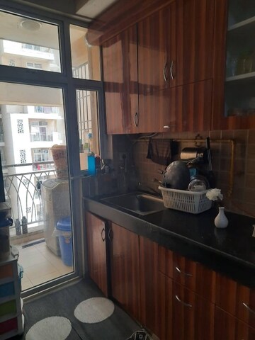 Kitchen in 3 BHK Apartment at Mahagun Mywoods, Sector 16c Greater Noida – for Rent