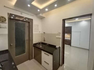 Kitchen in 2 BHK Apartment at Runwal Gardens, Dombivli East – for Rent