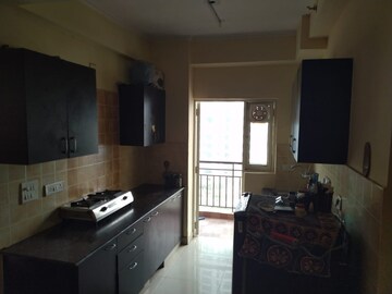 Kitchen in 2.5 BHK Apartment at Aims Golf City, Sector 75 – for Rent