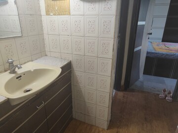 Bathroom in 2 BHK Apartment at Silver Anklet Apartments, Versova – for Rent