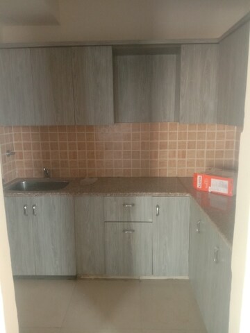 Kitchen in 2 BHK Apartment at Mahagun Mywoods, Sector 16c Greater Noida – for Rent