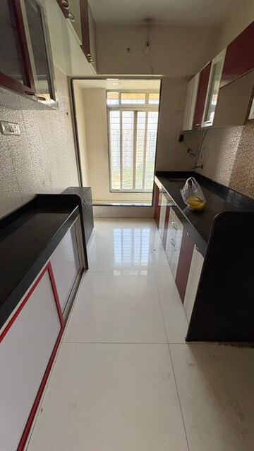 Kitchen in 2 BHK Apartment at Raunak Park View, Ghodbunder Road – for Sale