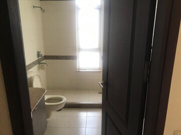 Bathroom in 3 BHK Apartment at Tata Raheja Raisina Residency, Sector 59 – for Sale
