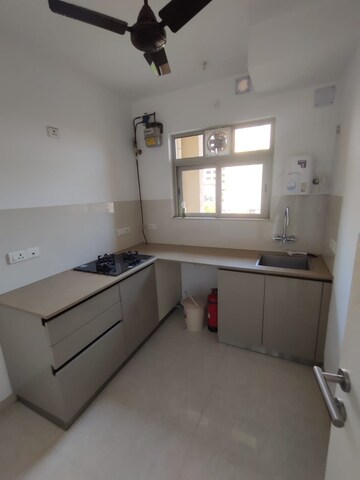 Kitchen in 1 BHK Apartment at Hiranandani Estate Solitaire C, Ghodbunder Road – for Rent