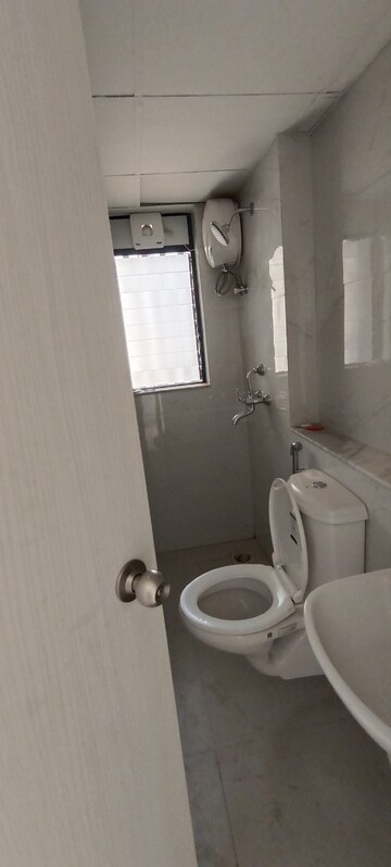 Bathroom in 1 BHK Apartment at Runwal Gardens, Dombivli East – for Rent