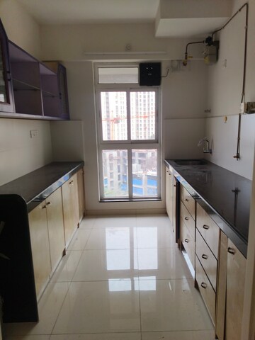Kitchen in 3 BHK Apartment at Godrej Emerald, Ghodbunder Road – for Rent