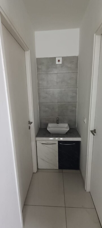Bathroom in 1.5 BHK Apartment at Godrej Garden City, Jagatpur – for Rent