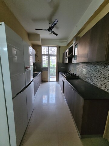 Kitchen in 3 BHK Apartment at JM Aroma, Sector 75 – for Rent