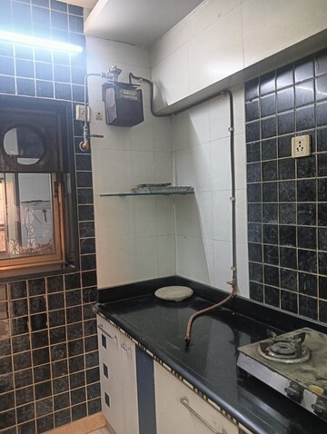 Kitchen in 3 BHK Apartment at Regency Estate, Dombivli East – for Sale