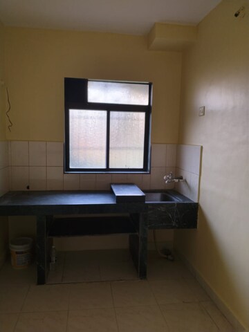 Kitchen in 2 BHK Apartment at Mohan Pride, Kalyan West – for Sale