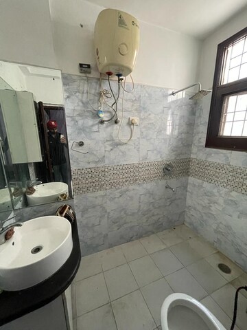 Bathroom in 3 BHK Apartment at Raglan Gulmohar Trends, Dhakoli Village – for Rent
