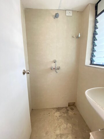 Bathroom in 1 BHK Apartment at Runwal Gardens, Dombivli East – for Rent