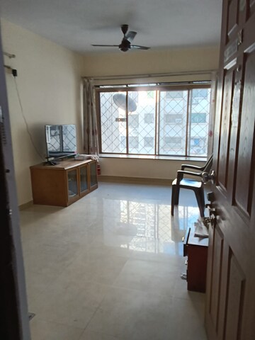 Living Room in 1 BHK Apartment at RNA Regency Park, Kandivali West – for Sale