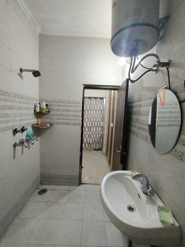 Bathroom in 2 BHK Apartment at Shri Devaji Residency, Dhakoli Village – for Rent