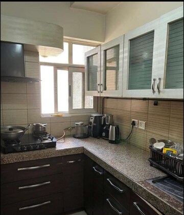 Kitchen in 2 BHK Apartment at Amrapali Heartbeat City, Sector 107 – for Sale