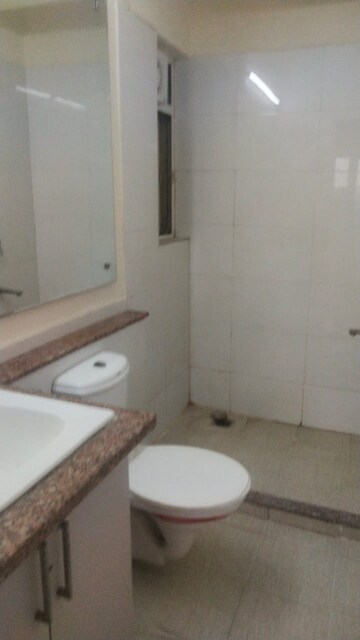 Bathroom in 3 BHK Apartment at Moti Nagar – for Rent
