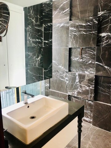 Bathroom in 4 BHK Builder Floor at Aarone Botanica, Neeti Bagh – for Rent