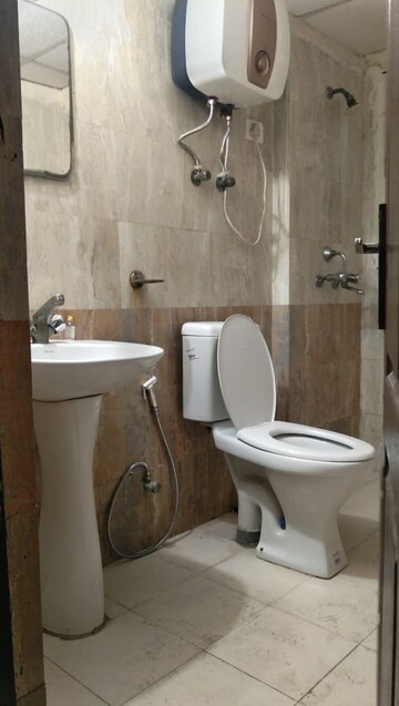 Bathroom in 2 BHK Apartment at Aims Golf City, Sector 75 – for Rent