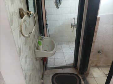 Bathroom in 1 BHK Apartment at Brahmand CHS, Brahmand – for Sale