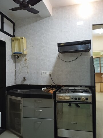 Kitchen in 2 BHK Apartment at Rajkumar Corner CHS, Andheri West – for Rent